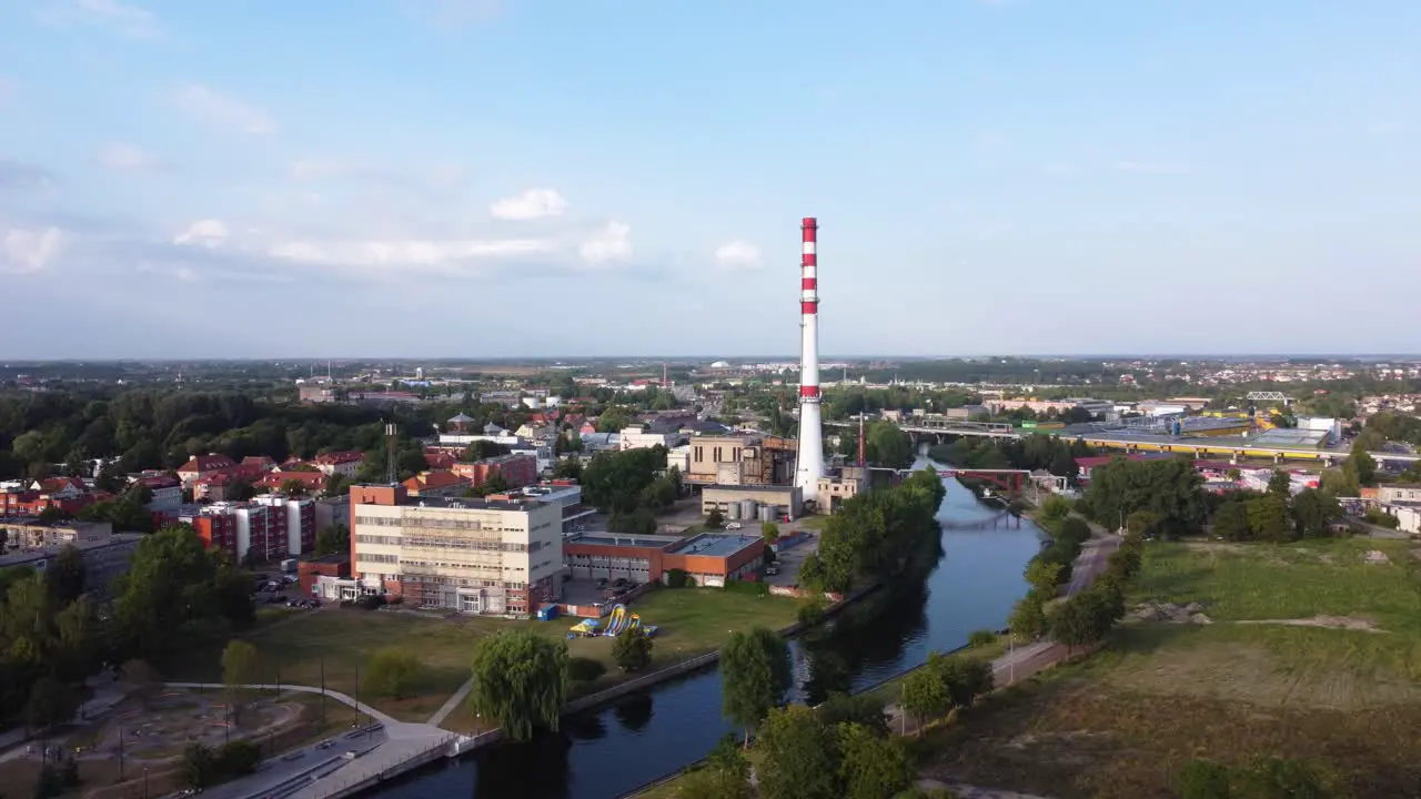 AERIAL Orbiting Shot of a Soviet Thermal Power Plant and its Tower in Klaipeda Lithuania