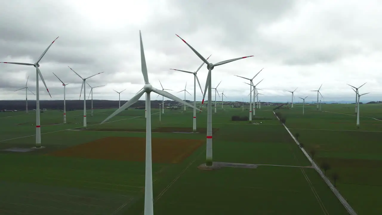 Clean Energy in Motion Spinning Windmills Generating Sustainable Power on a Cloudy Day in North Rhine-Westphalia near Bad Wünnenberg Paderborn  Germany