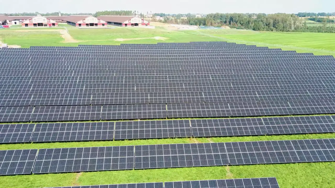 Aerial View of Big Sustainable Electric Power Plant With Many Rows of Solar Photovoltaic Panels for Producing Clean Ecological Electrical Energy