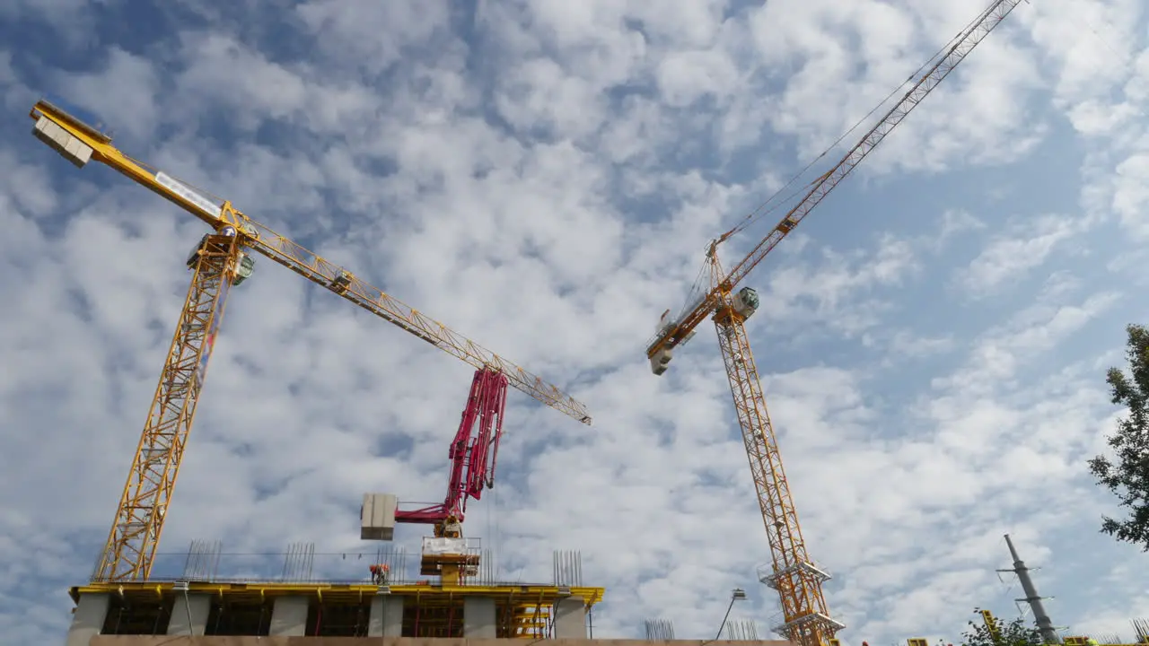 Timelapse of building house against sailing clouds