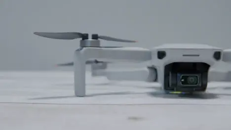 Sliding Shot of DJI Mini 2 Drone Sitting On Table