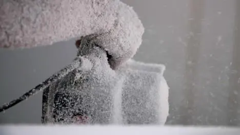 Handheld Close Up Shot of Power Tool Being Used On Polystyrene Surfboard