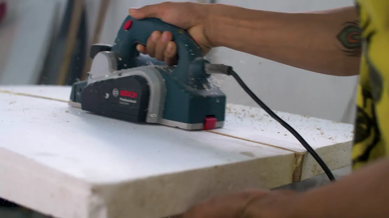 Handheld Close Up Shot of Surfboard Shaper Crafting Surfboard