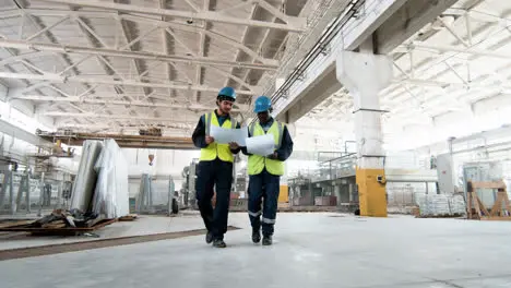 Workers talking at a marble factory