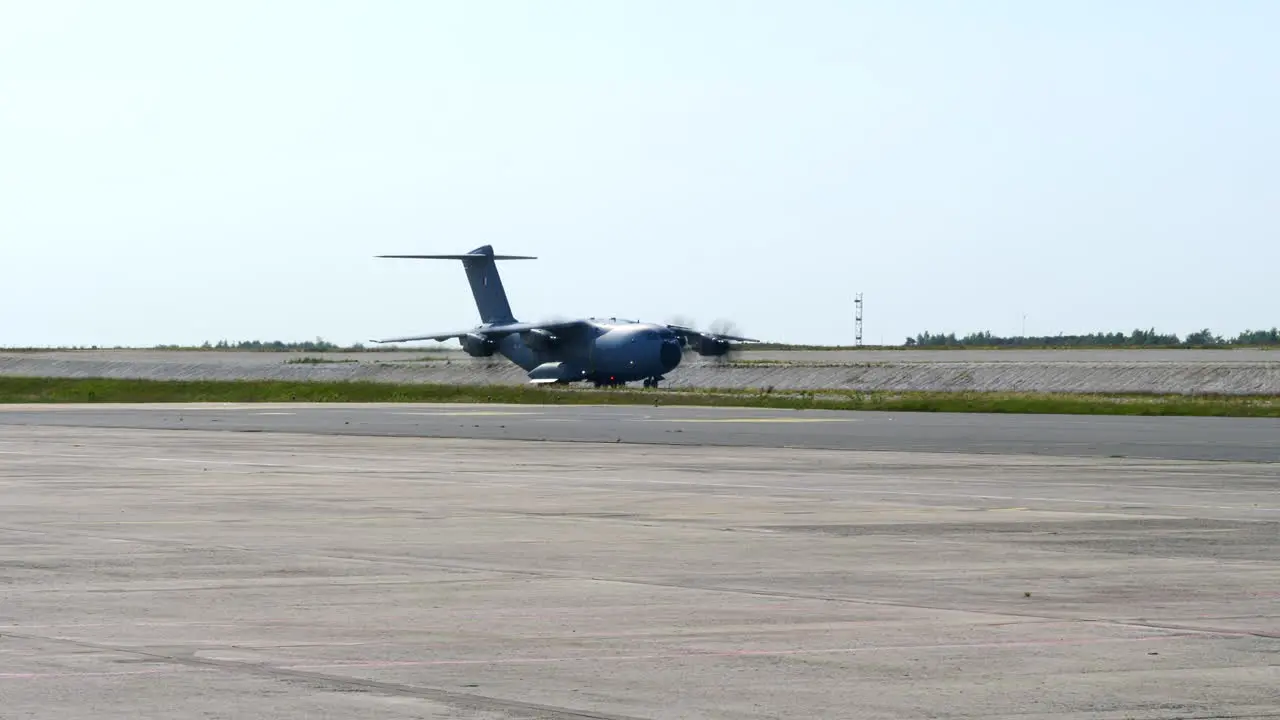 Airbus A400M Military Aircraft Taxiing on Runway Wide Tracking shot