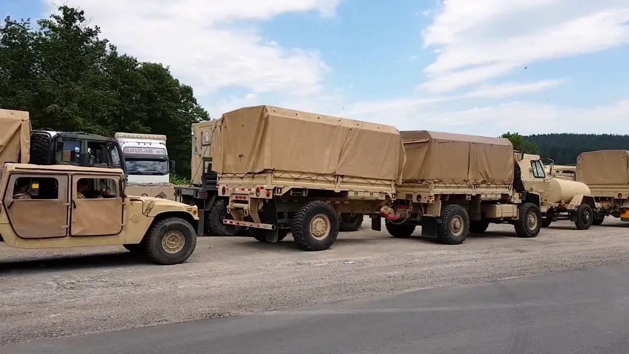 American Army Vehicles Parked On The Roadside In Omurtag Bulgaria View From A Moving Vehicle