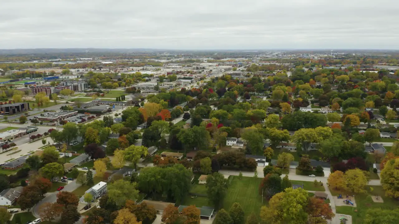 Drone Flies Backwards Over Suburban Homes with Fall Colors