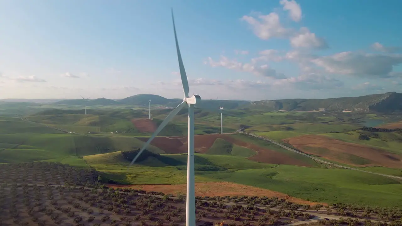 Aerial view of Ardales south of Spain with wind turbines corn and olive fields at daytime