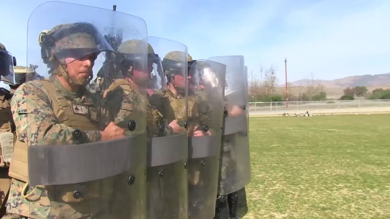 Troops Practice A Defensive Formation Against Rioters