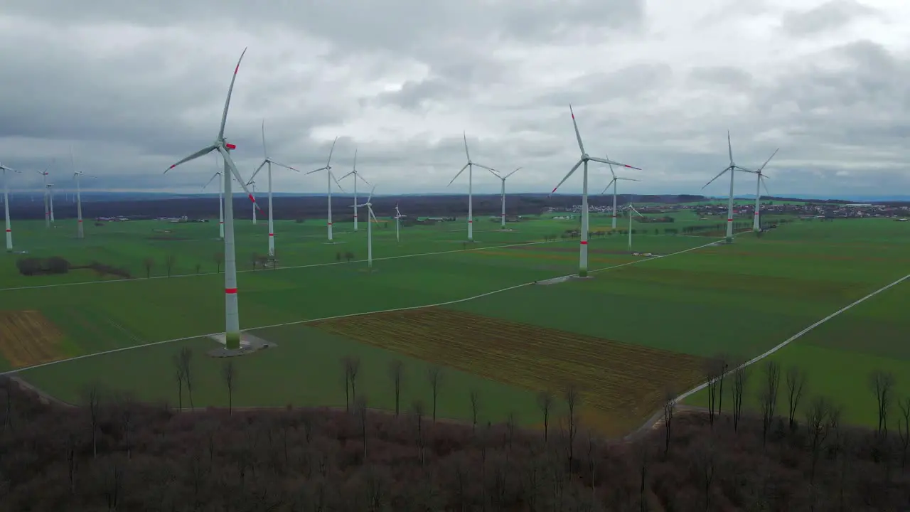 Cloudy Sky and Sustainable Energy Wind Turbines Generating Power on a Beautiful Field in Bad Wünnenberg Paderborn North Rhine-Westphalia Germany