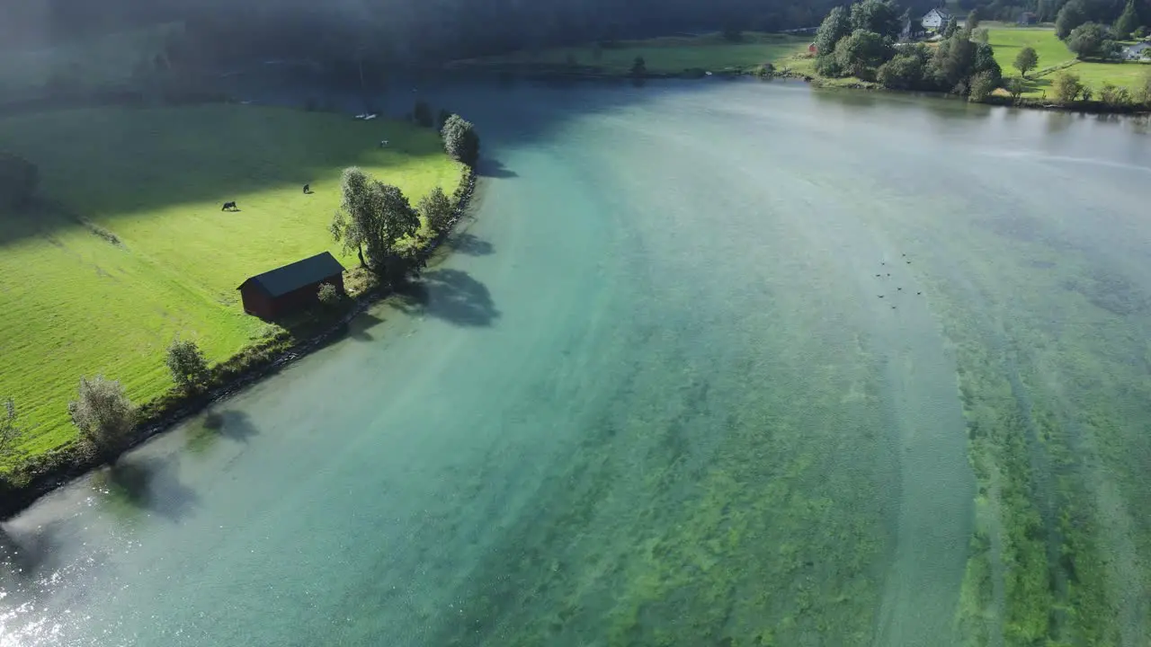 Drone footage of beautiful Stryn river with green glacier Water