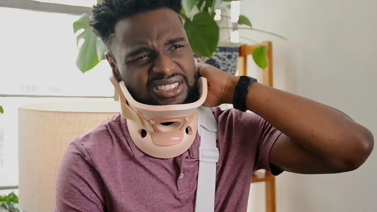 Man Wearing A Neck Brace