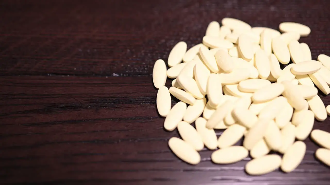 pile of yellow pills smooth left to right slide