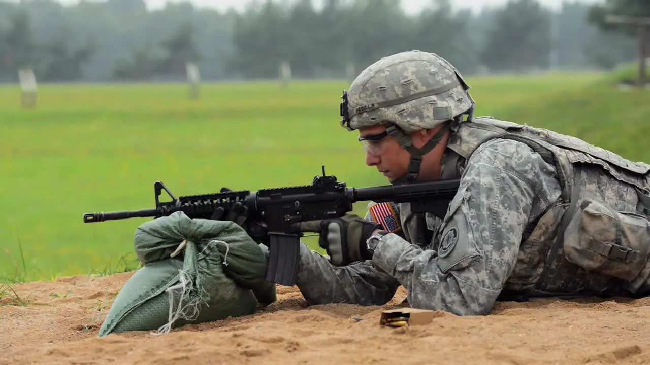 Soldiers Fire The M4 Carbine Rifle On A Simulated Battlefield