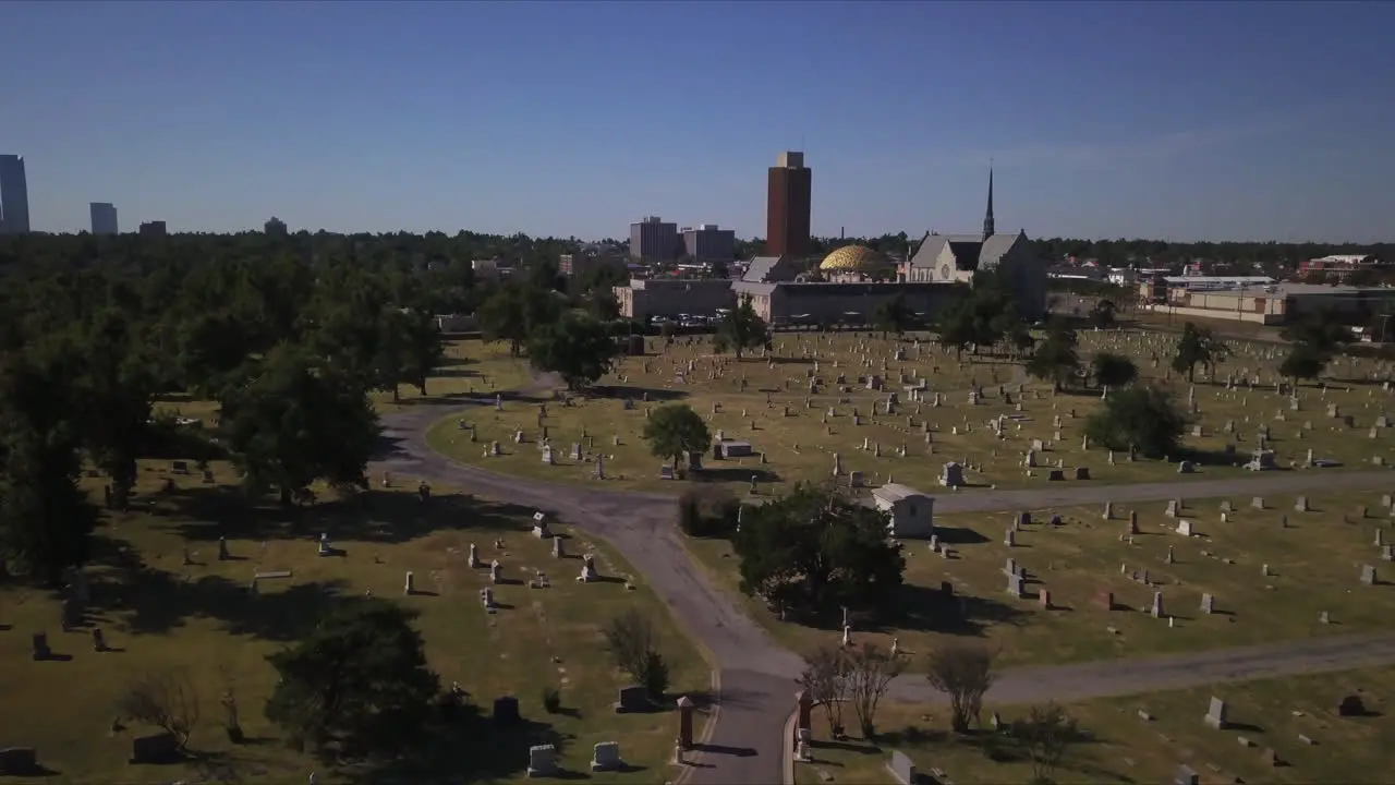 Aerial establishing shot of the cemetery during midday