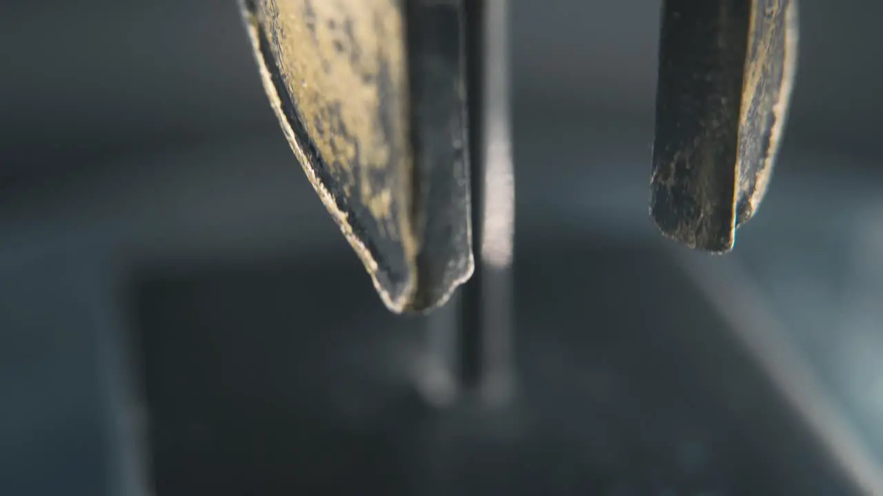 A close up macro detailed slow tilt up shot of a spartan face design warrior ancient greek sign bronze helmet on a 360 rotating stand studio lighting 4K smooth movement