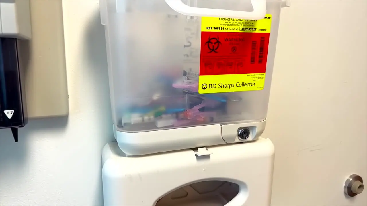 Biohazard Medical Sharps And Disposal Container In Doctors Office