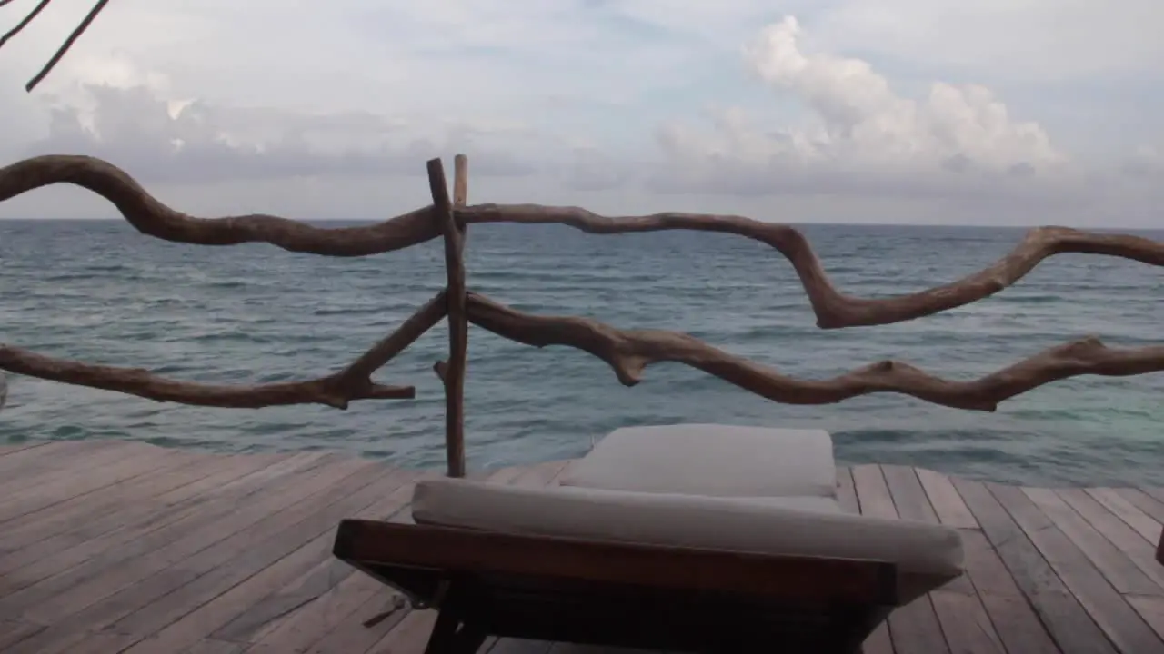 first person vision long shot inside a balcony looking to the caribbean ocean during a cloudy day