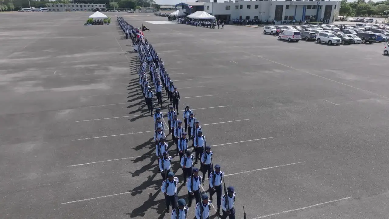 Military parade marching soldiers San Isidro airbase aerial orbit over people