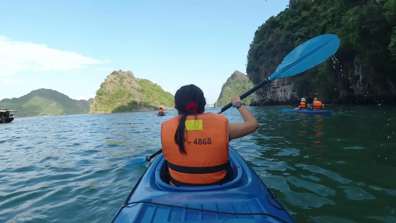 Kayaking in the sea around Halong Bay Vietnam