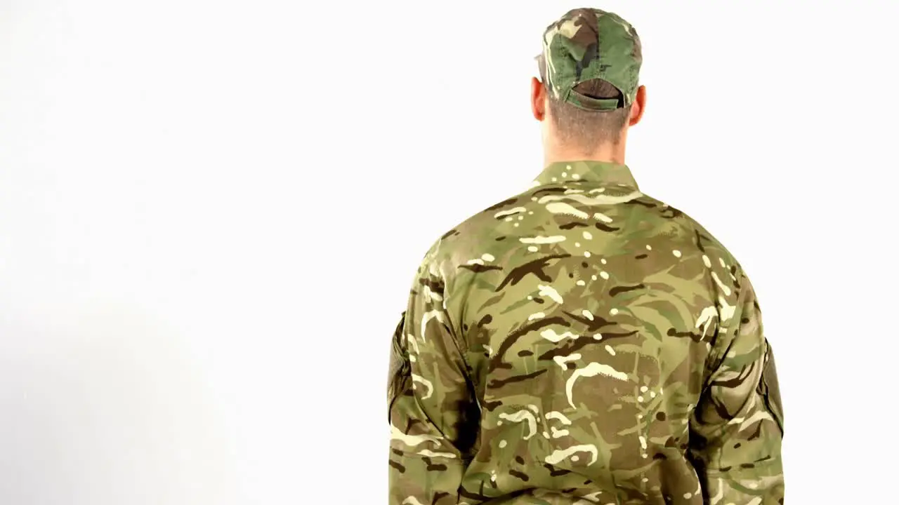 Soldier saluting on white background