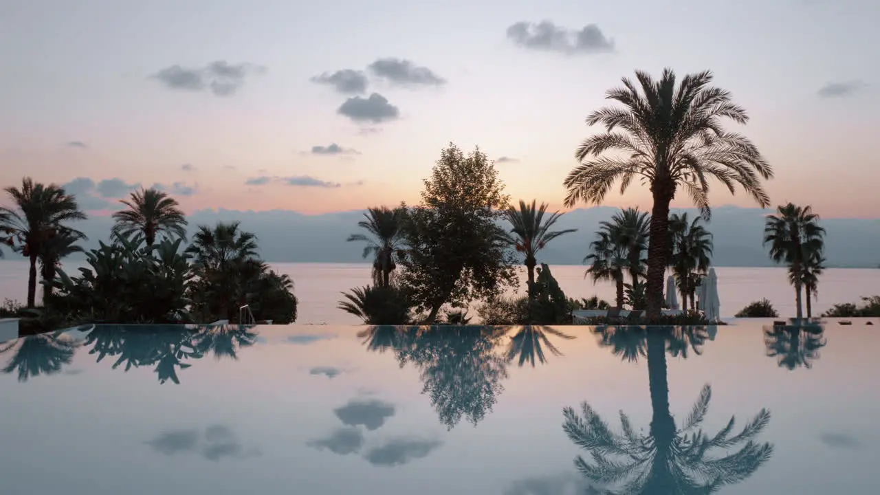 Steadicam shot of evening view near a swimming pool