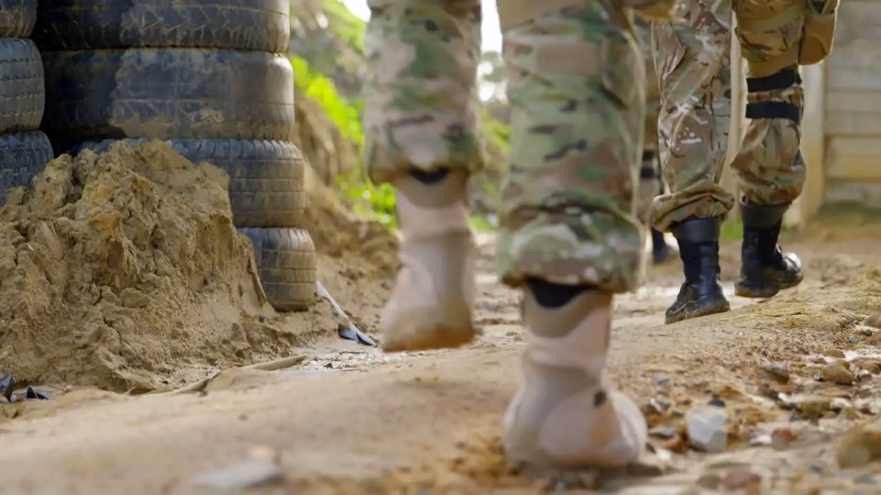 Low section of military soldiers walking during military training 4k