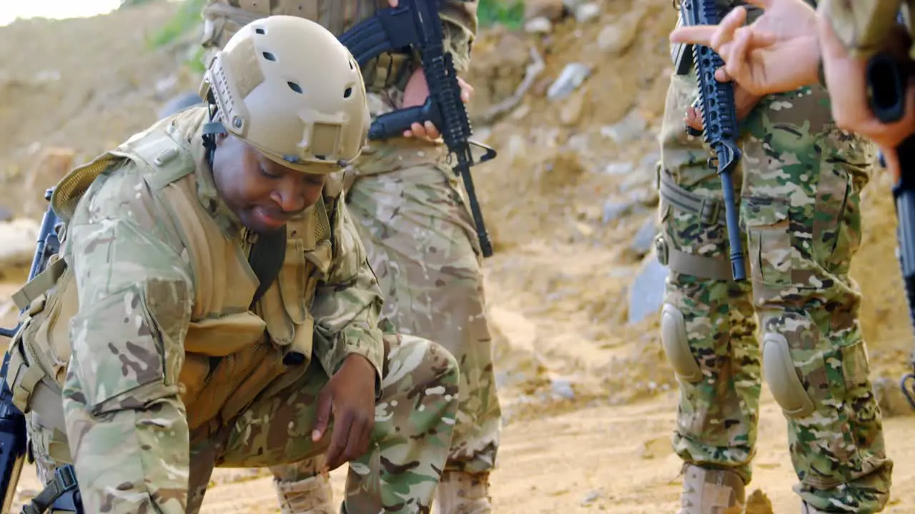 Mixed-race military soldiers planing on field during military training 4k