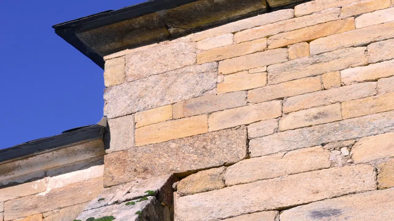 Professional drone flying next to a romanesque church