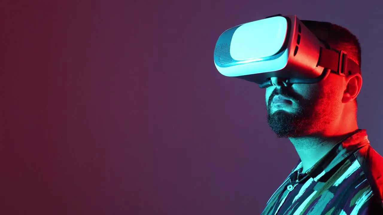 young man wearing virtual reality goggles with copy space