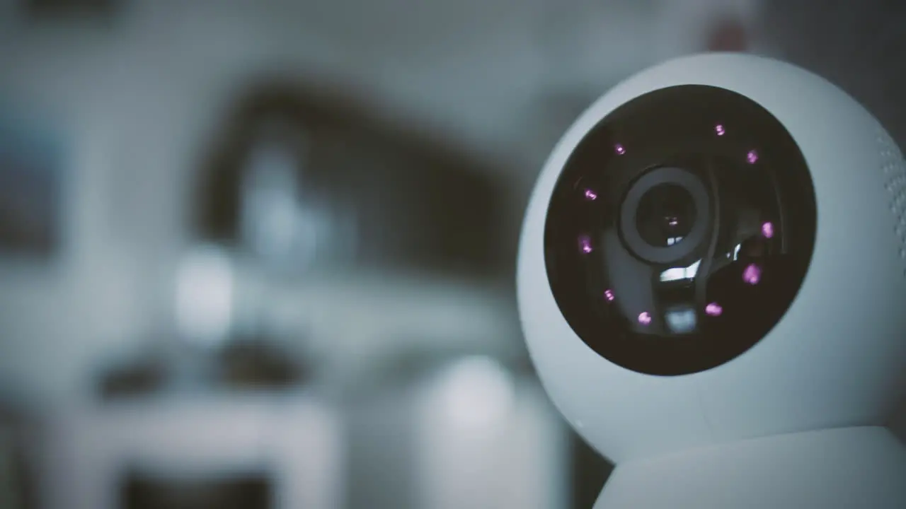 Home security camera scans the home environment with blurred background