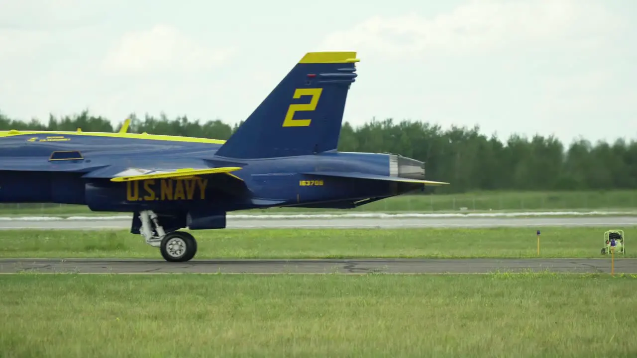 Boeing F-A-18 Hornets taxiing across a runway in single file