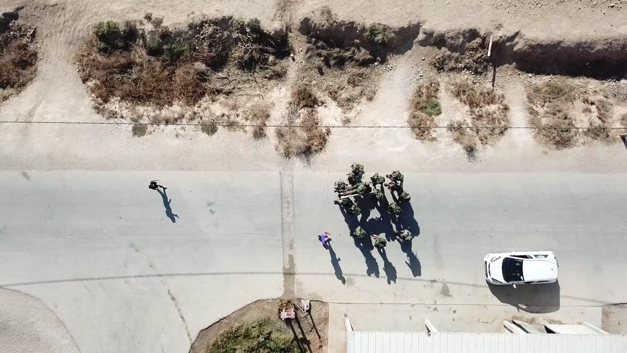 Drone top shot A number of First Army soldiers practicing evacuating the injured