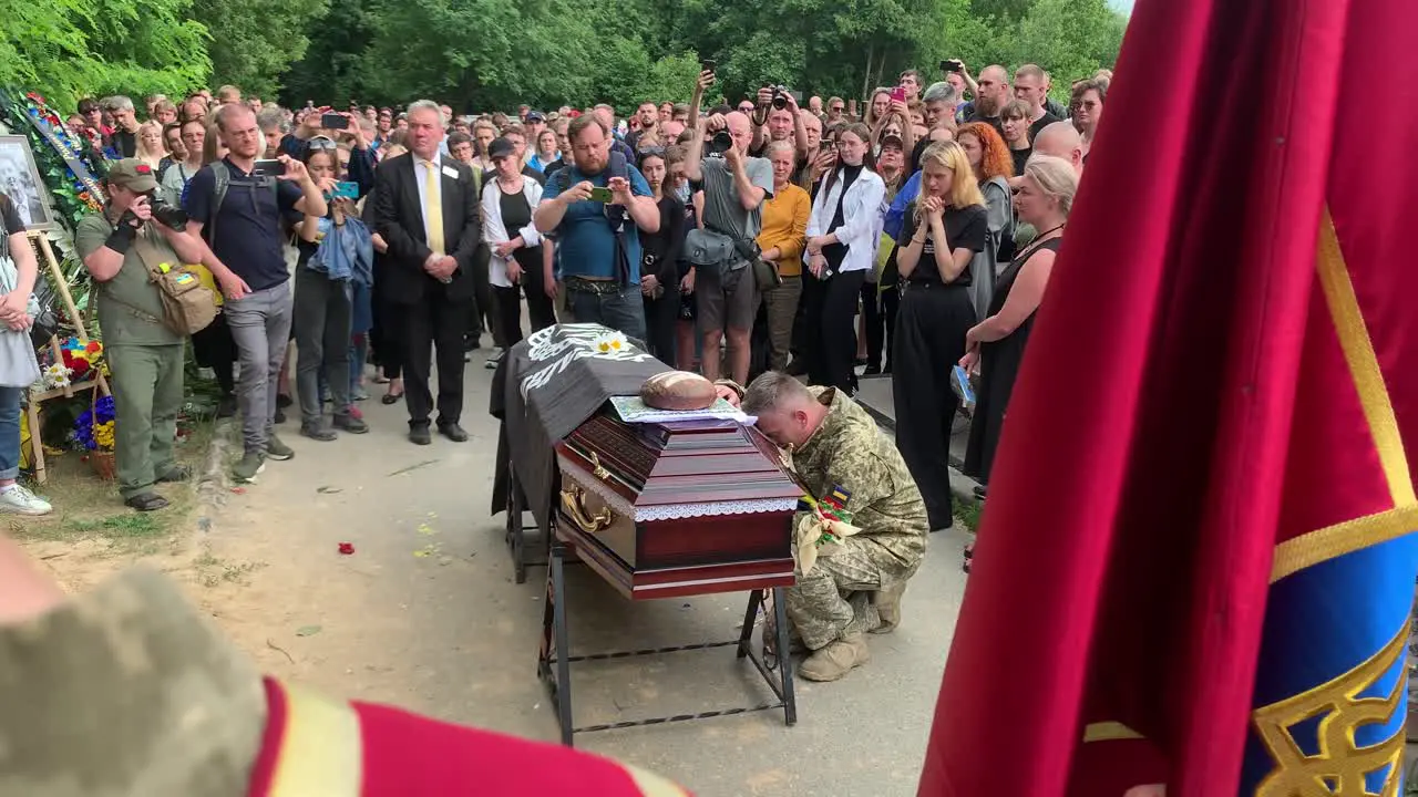 A Large Crowd Mourns At A Soldier'S Funeral In Ukraine During The Ukraine War