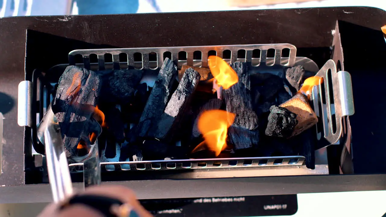 Replacing charcoal and firestarters in the grill for a perfectly set barbecue