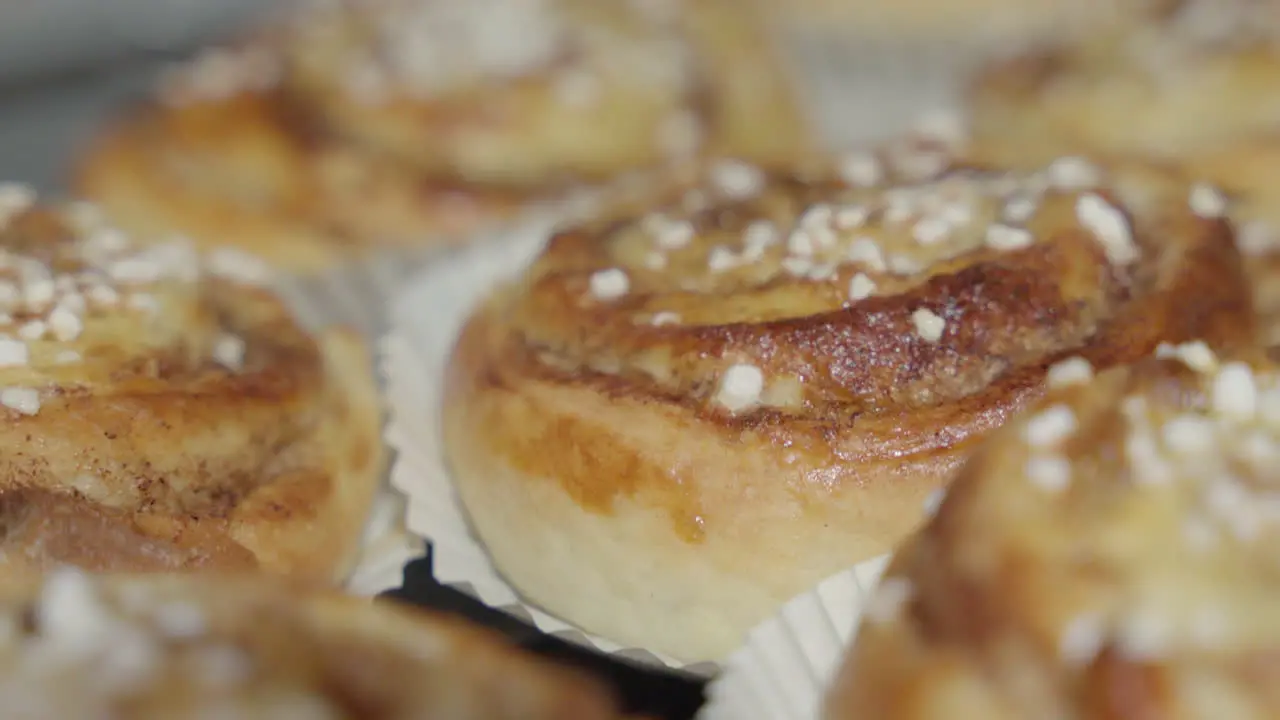 Close up slider shot of a pile of cinnamon buns at a Swedish fika