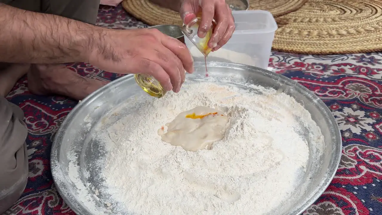 Wheat flour fermentation process to make dough and bake flat pizza bread in old brick clay oven wood fire bonfire burning in Iran a man bake bread in rural countryside village life local people Arabia