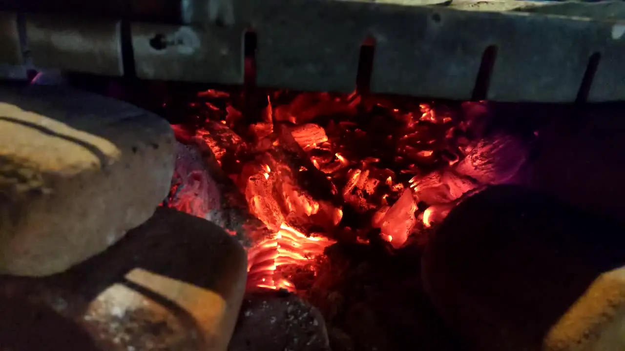 Tilt up shot of Guatemalan tortillas in traditional wooden stove