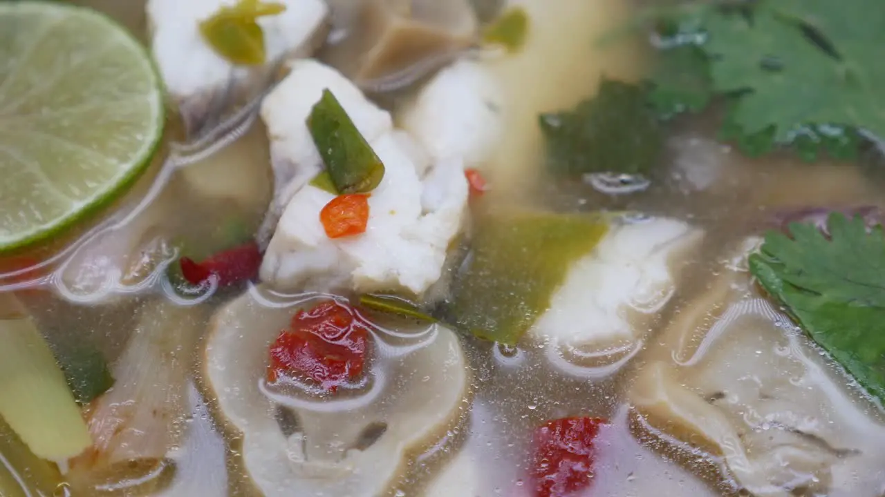 Close-Up Footage of Clear Tom Yum Soup With Sea Bass and Mushroom The Famous Thai Food Well Known By its Aromatic and Spicy Taste