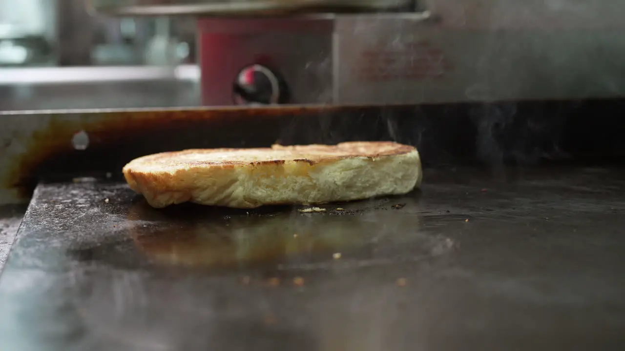 Toasting a bun on the flat top griddle food truck series