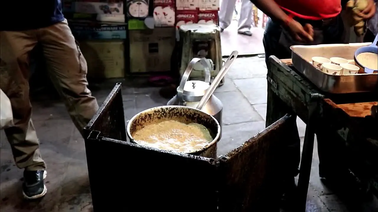 Vendor Preparing Chai Tea in Old delhi