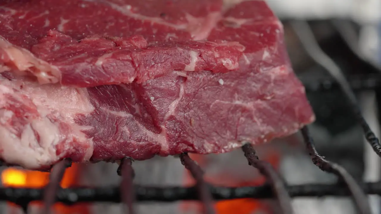 Close-up of grilled fillet steak on a charcoal grill