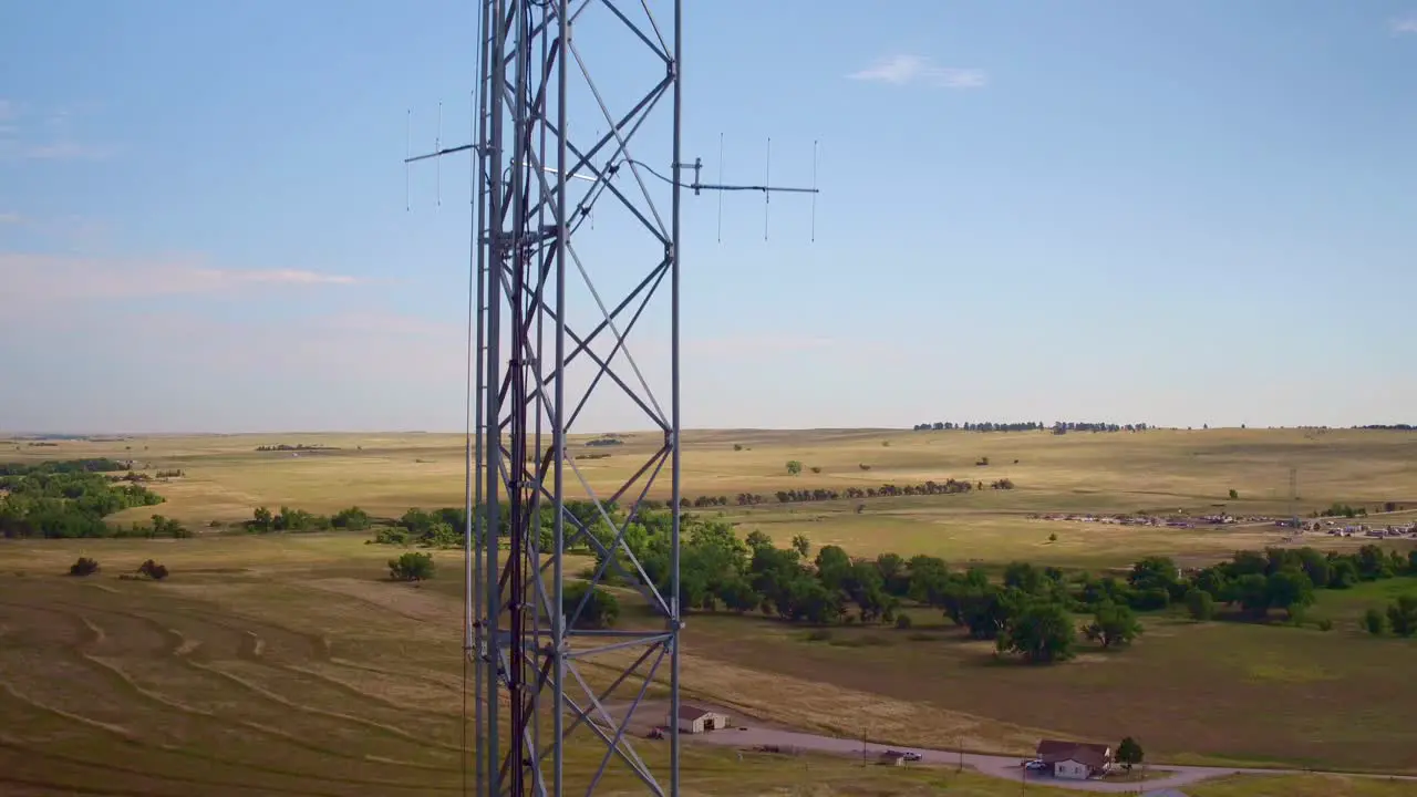 Drone view of a cellular tower with plains in the background