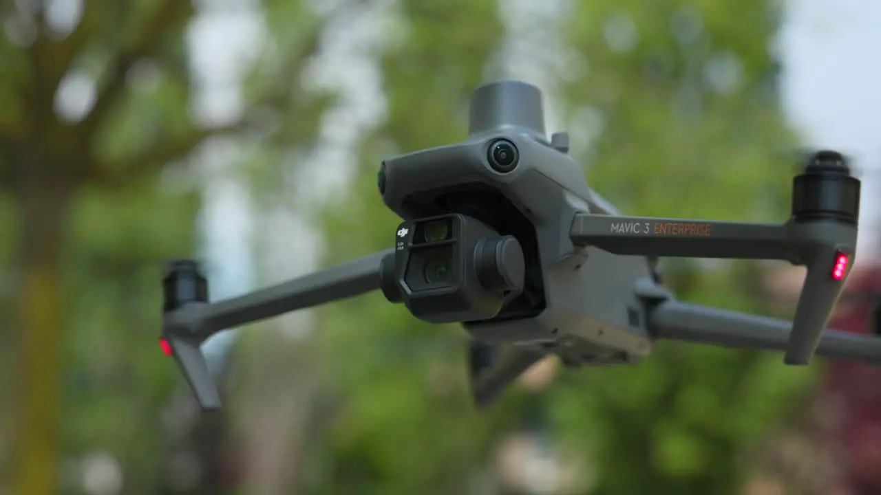 Close Up Shot Of DJI Mavic 3E Hovering With Bokeh Background