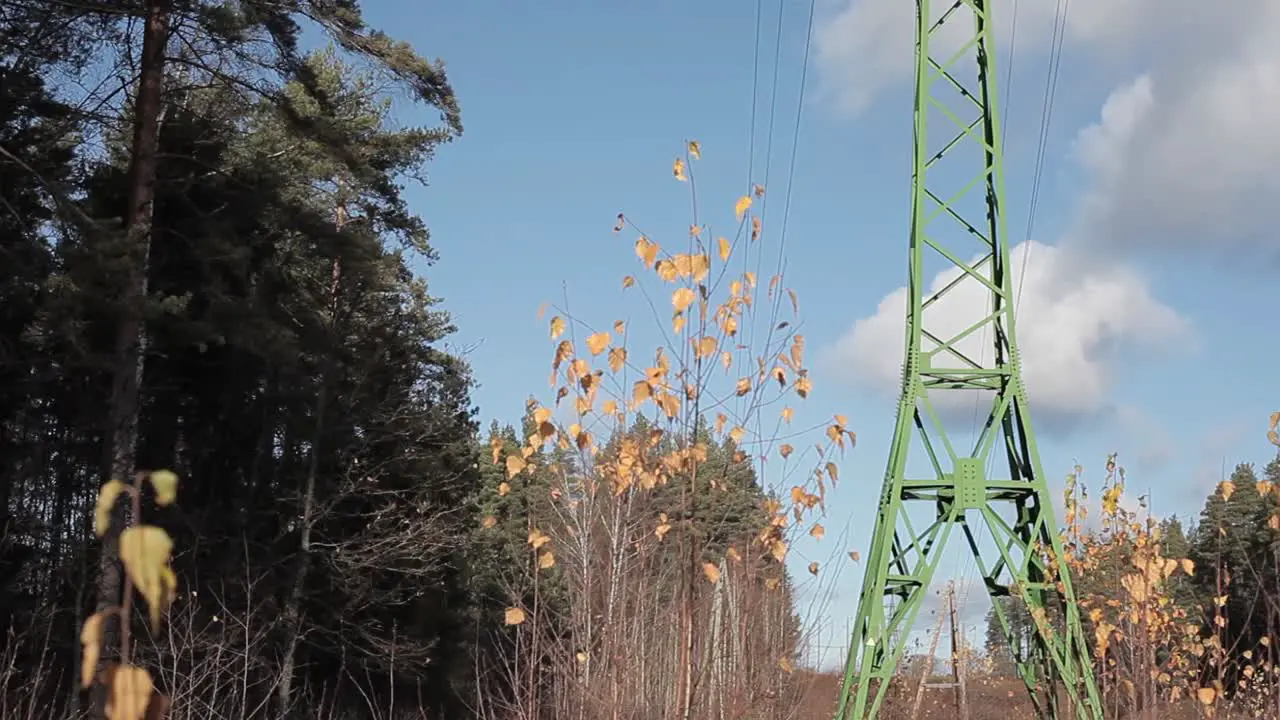 High voltage line with green metallic tower Green energy concept