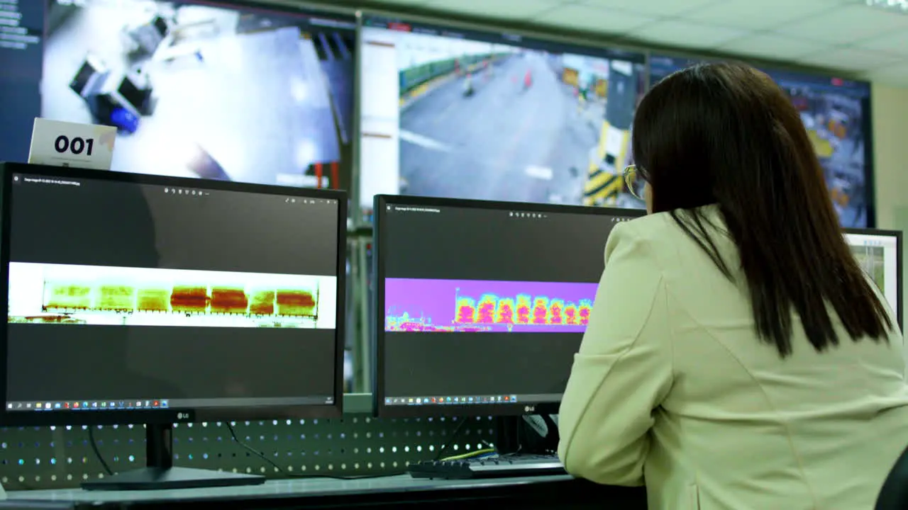 general shot of woman in surveillance room