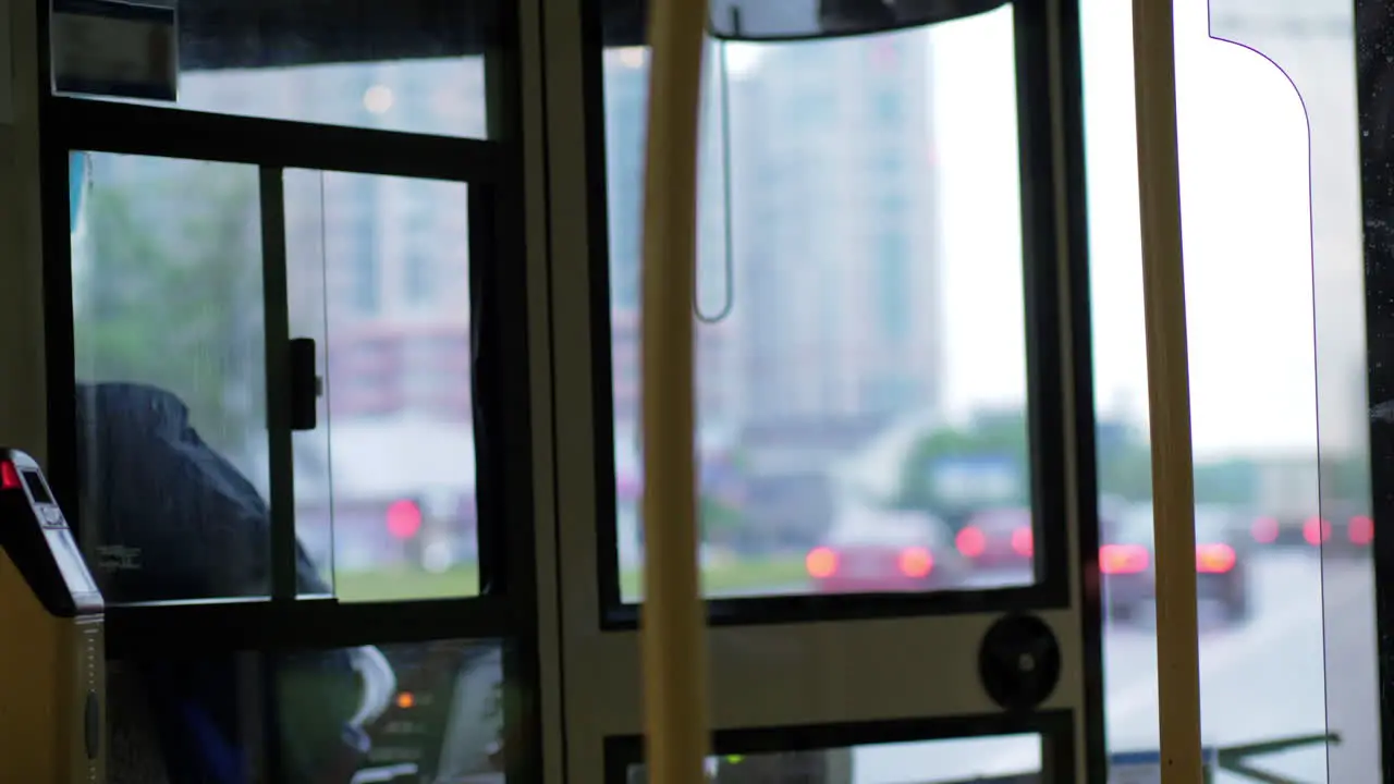 Woman driving bus in the city