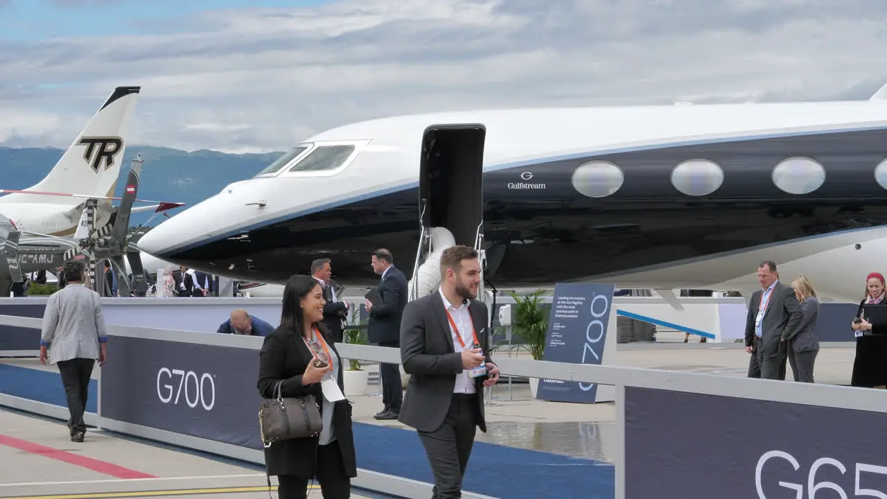 Attendees of EBACE look at Gulfstream G700 business aircraft at apron