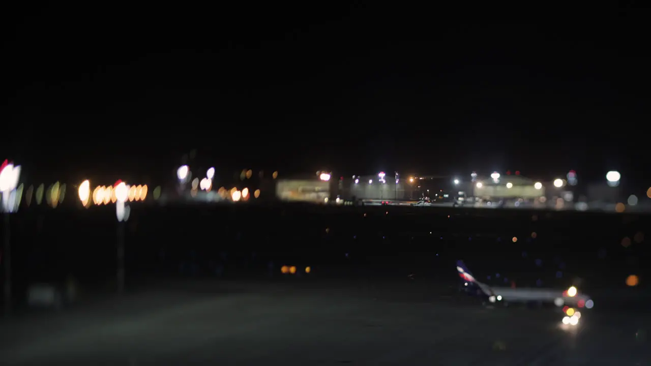 Timelapse of transport traffic in airport at night