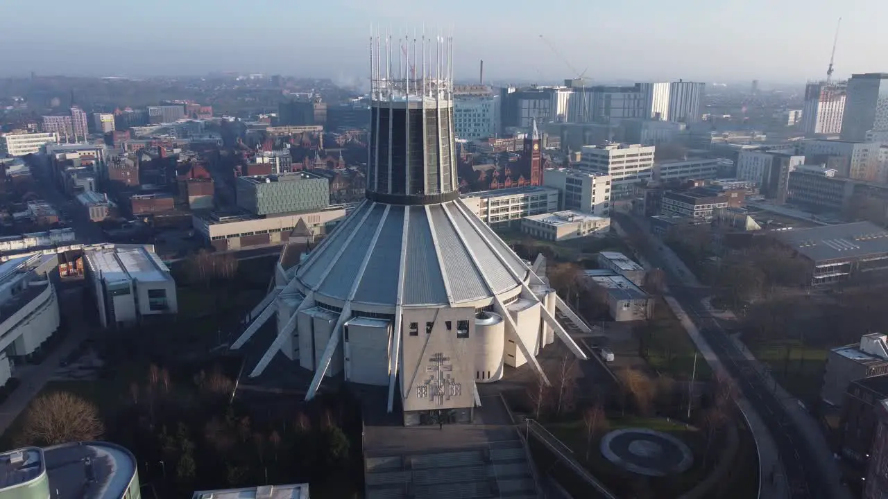 Liverpool Metropolitan cathedral contemporary city famous rooftop spires aerial left orbit